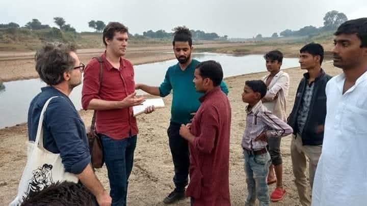 Volunteers and caretakers with children at a community centre